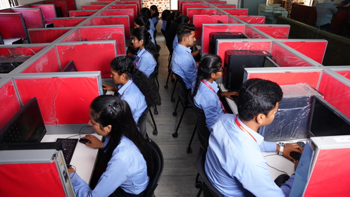 Students Working in Computer Lab at Omega Degree College